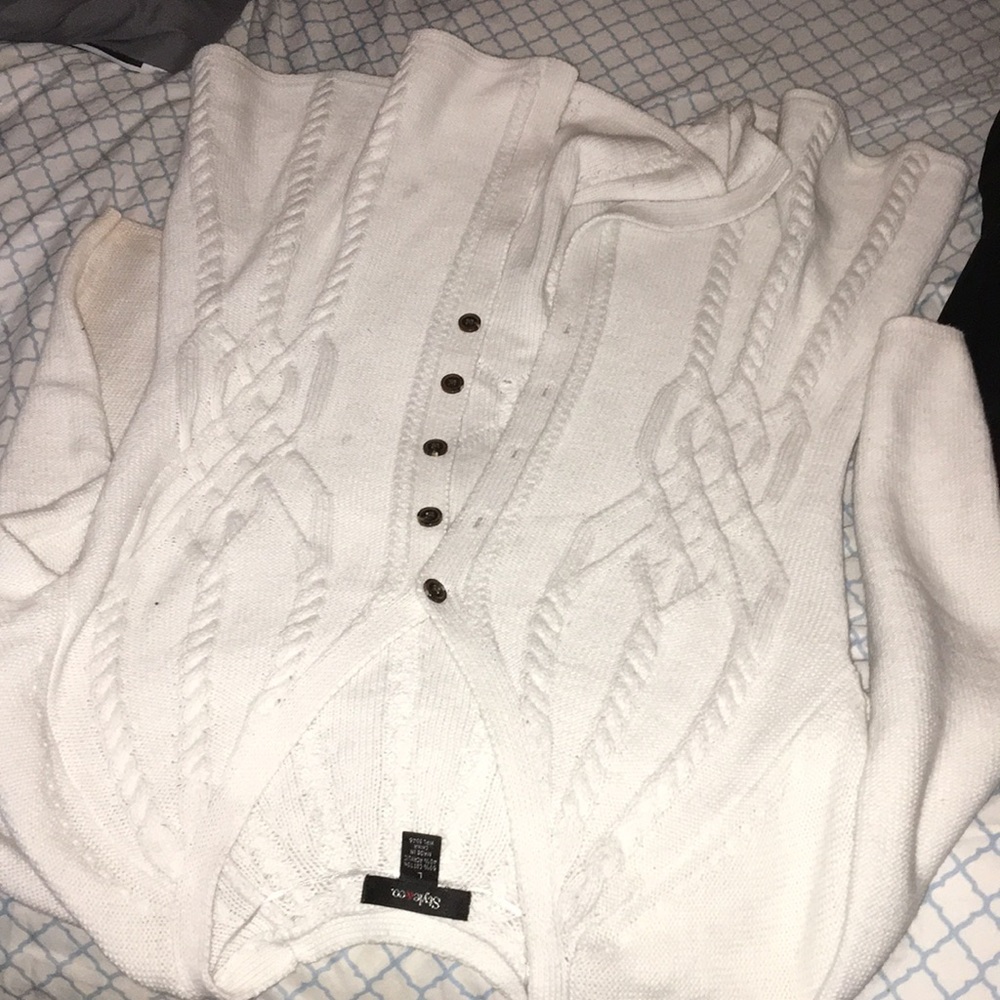 A white button up cardigan.